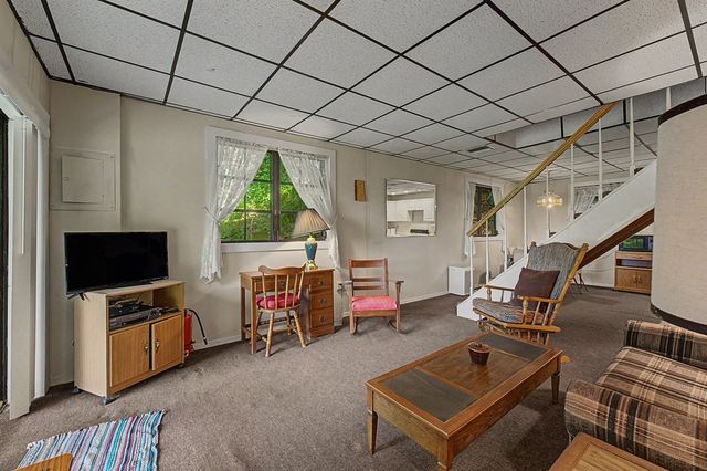 Living room with stairs to the upper level