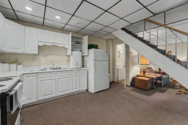 Kitchen and stairs to the upper level