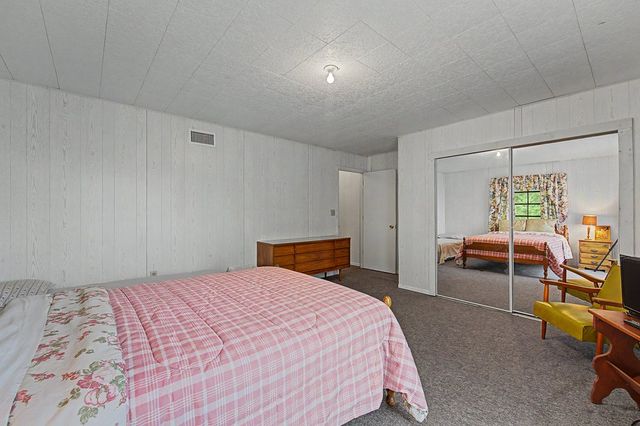 Bedroom with a mirrored closet