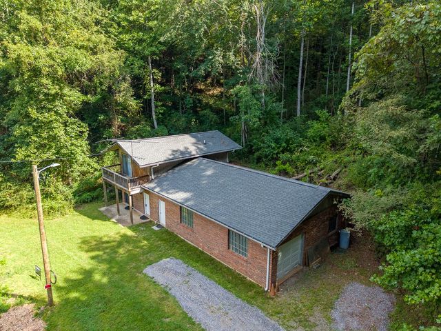 Aerial view of the home and garage wing