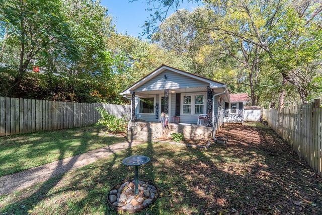 Front yard with the birdbath and the walkway to the porch