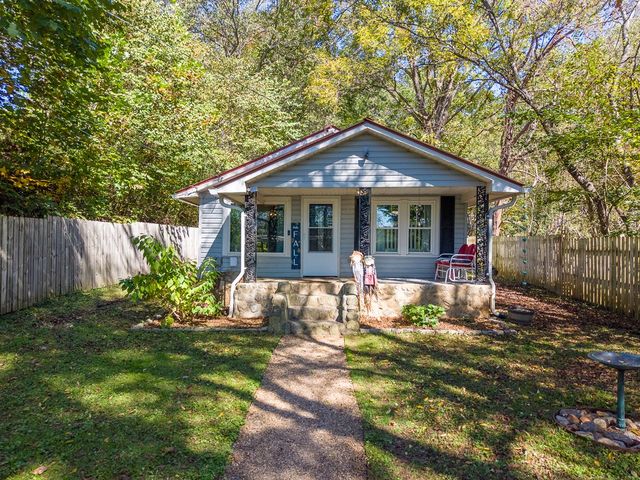 Front of the cottage with the stone porch steps
