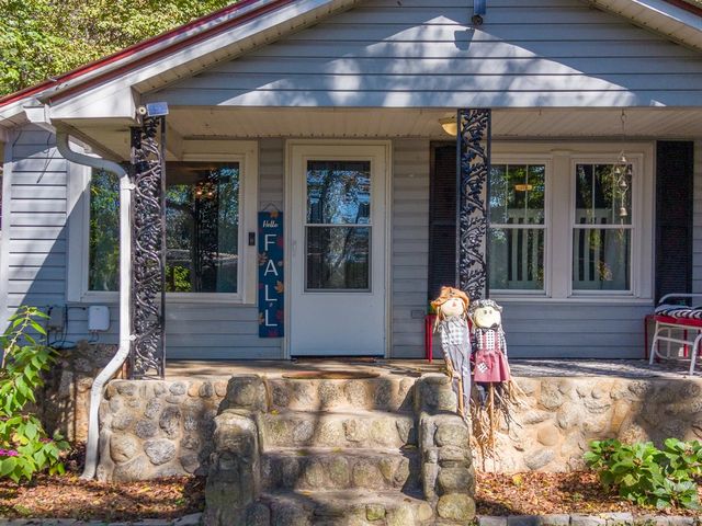Front door and stone porch steps