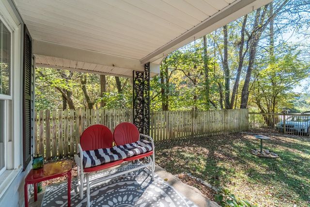 Covered front porch looking out over the yard