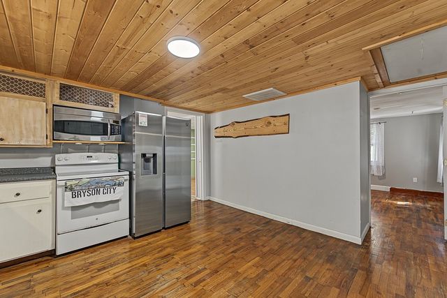 Kitchen range, microwave and refrigerator