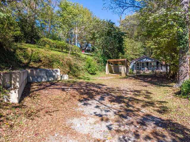 Driveway and parking area below the house