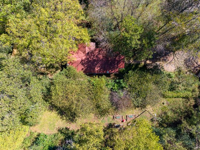 Aerial view of the house among the trees